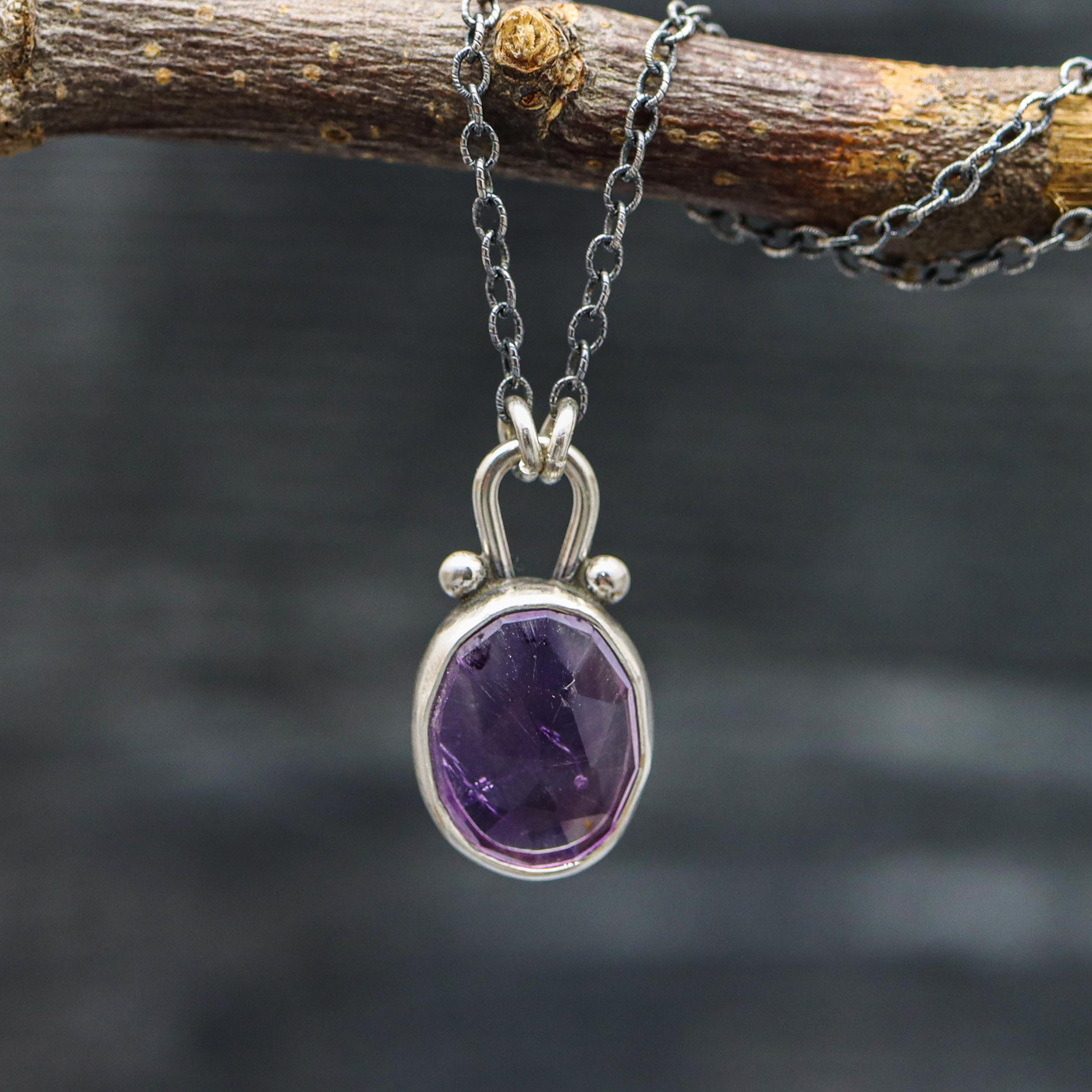 purple amethyst pendant on a cable chain